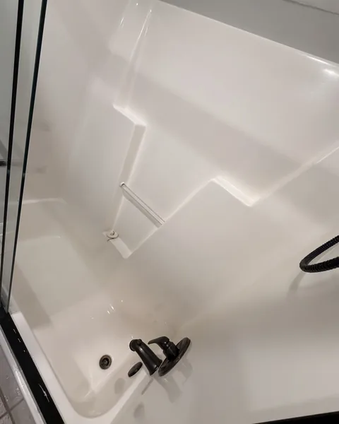 Spotless, gleaming bathtub and shower after professional cleaning in a Lexington SC home