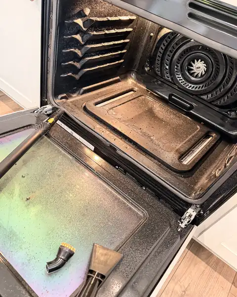 Grimy oven interior with heavy grease buildup before deep cleaning in a Lexington SC home