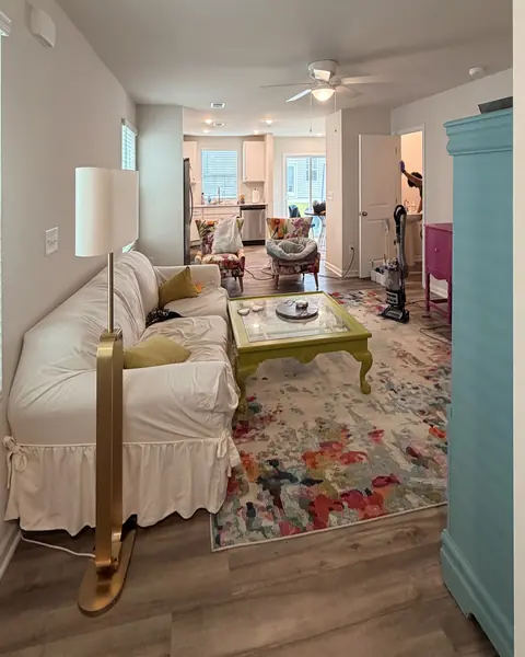 Living room mid-cleaning with supplies out in a Lexington SC home